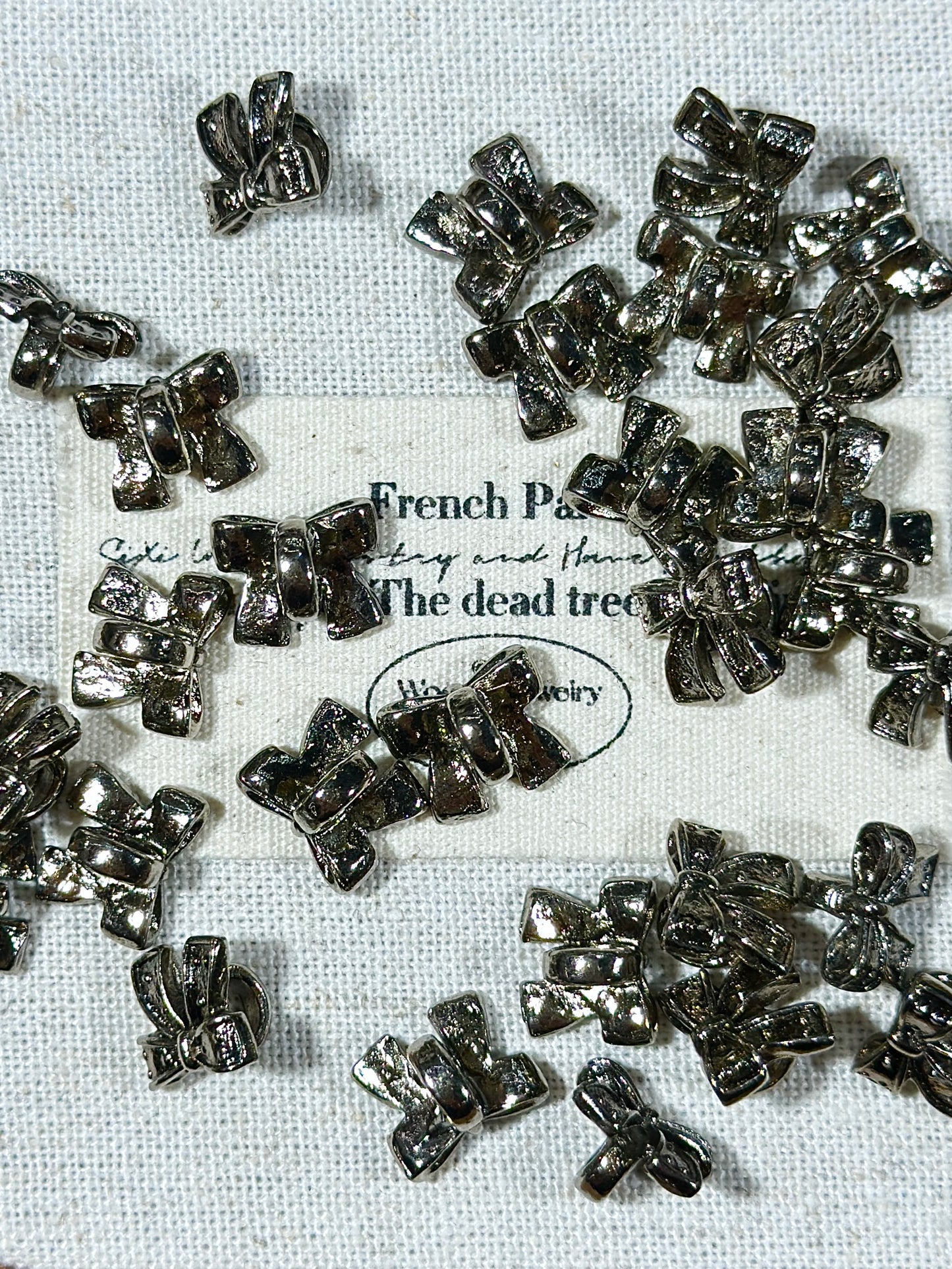 Gunmetal bow spacer beads
