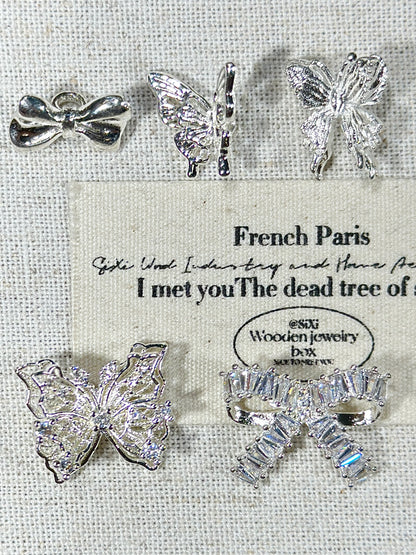 Bright silver butterfly spacer