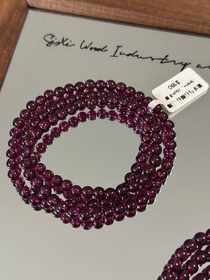 Purple tooth black garnet three circles