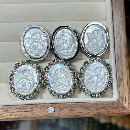 White mother-of-pearl oval magic box