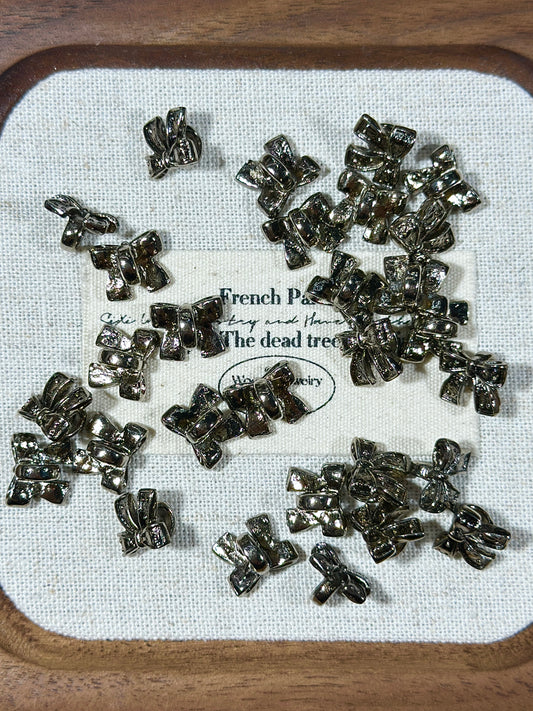 Gunmetal bow spacer beads