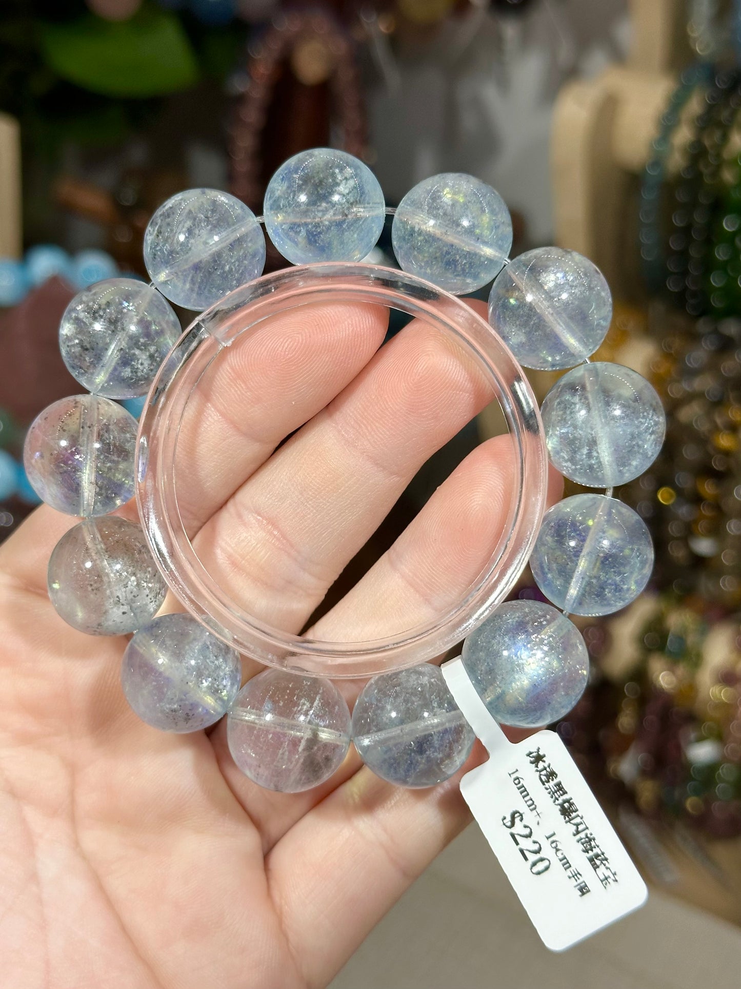 Ice-clear black glittering aquamarine crystal