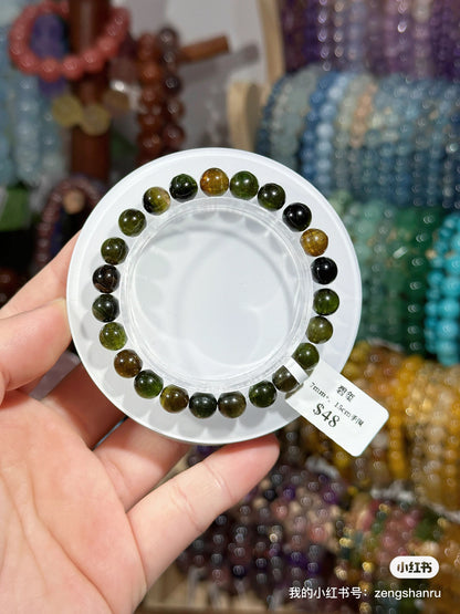 Full green tourmaline crystal