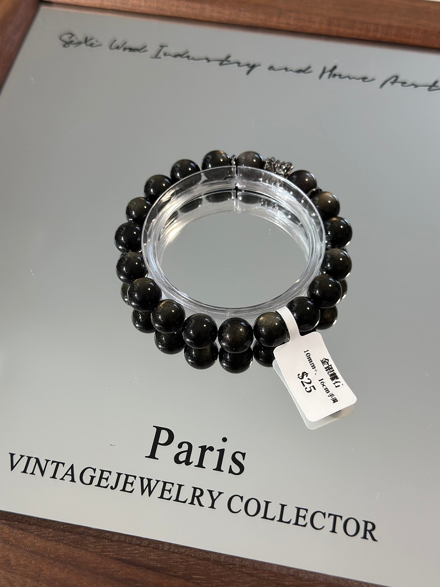 Gold, silver and obsidian design