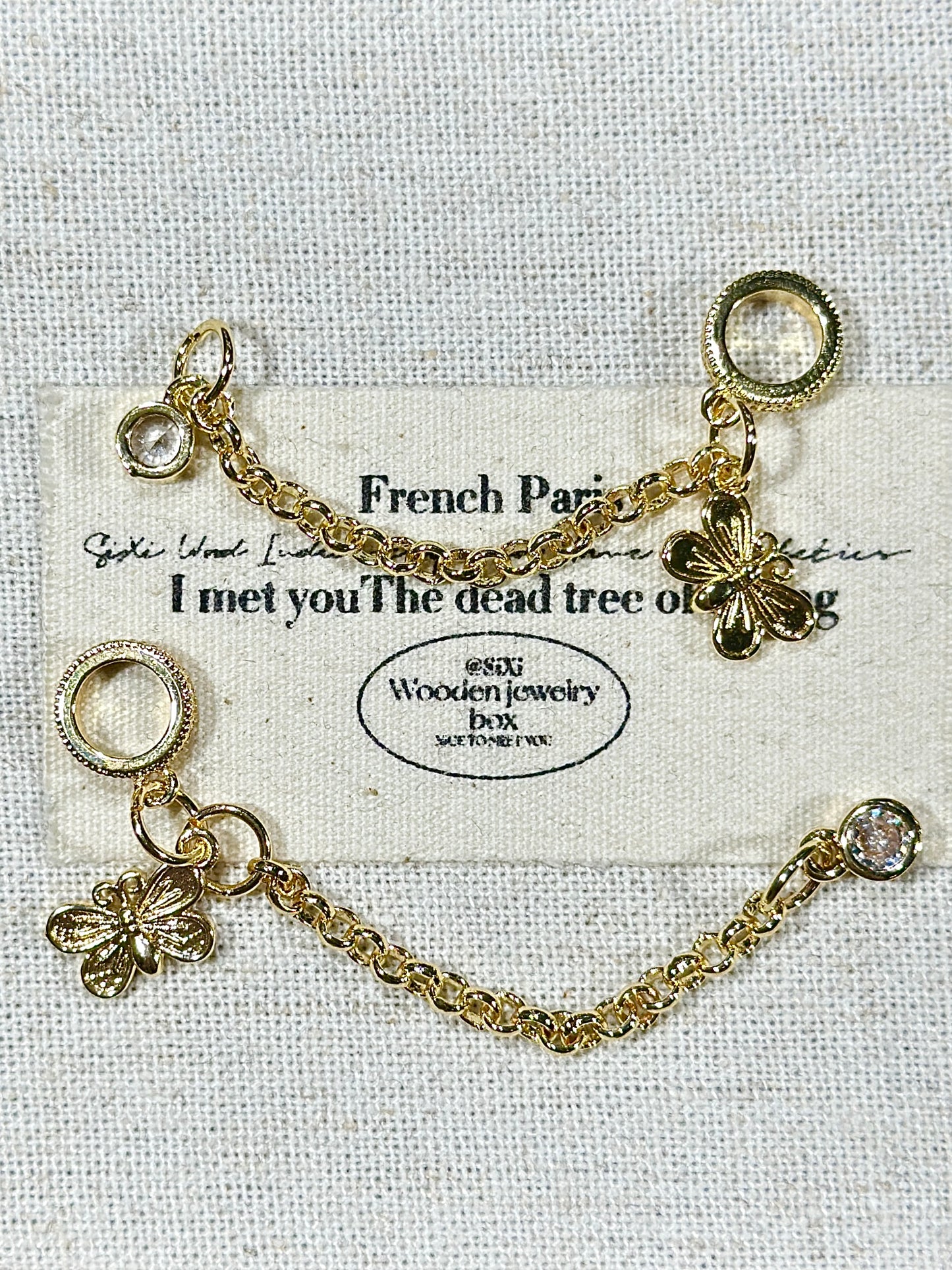 Bright gold butterfly safety chain