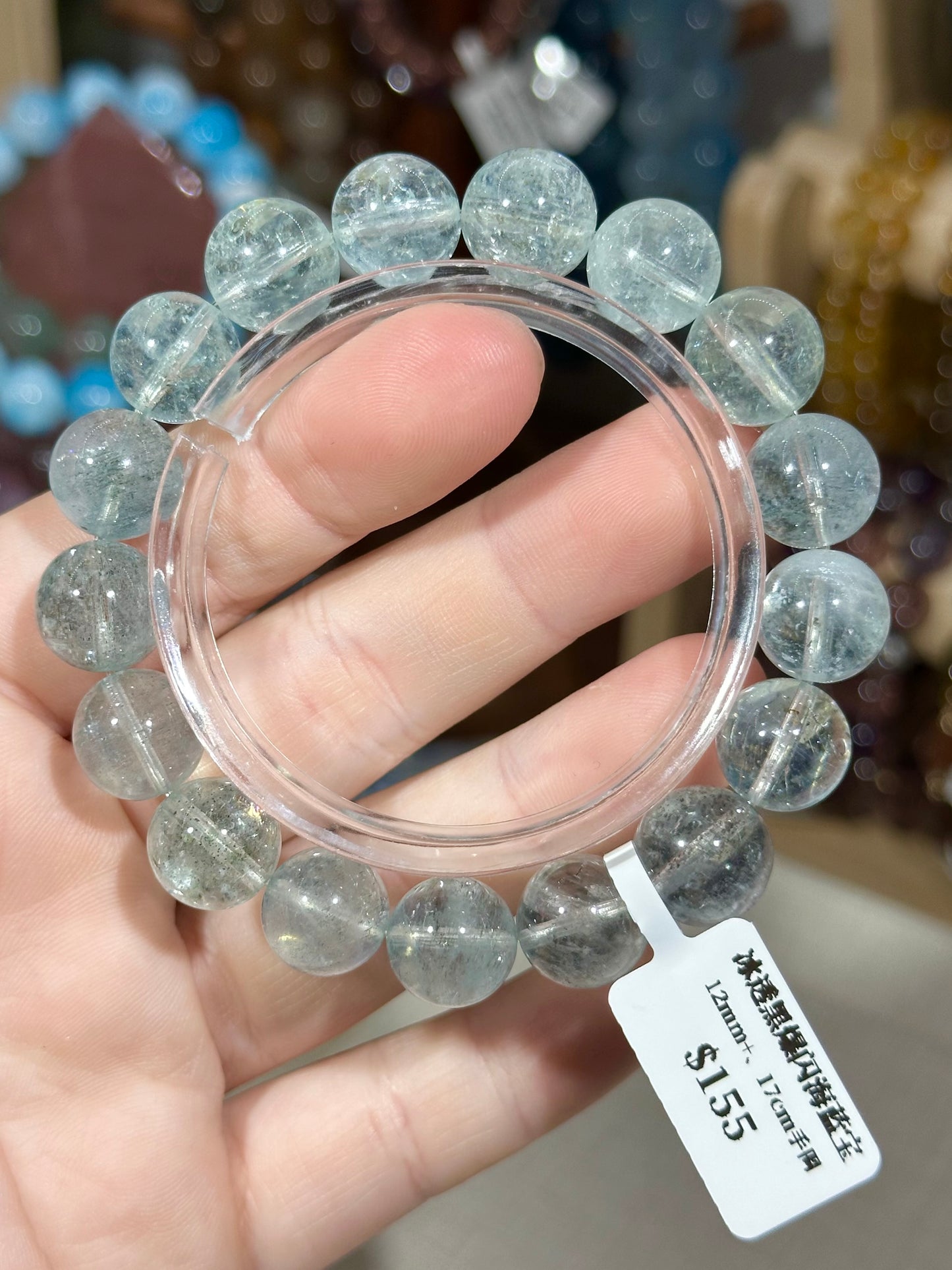 Ice-clear black glittering aquamarine crystal