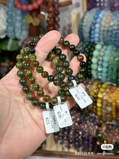 Full green tourmaline crystal