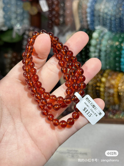 Orange garnet multiple rings