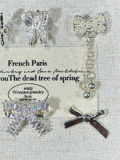 Bright silver butterfly spacer