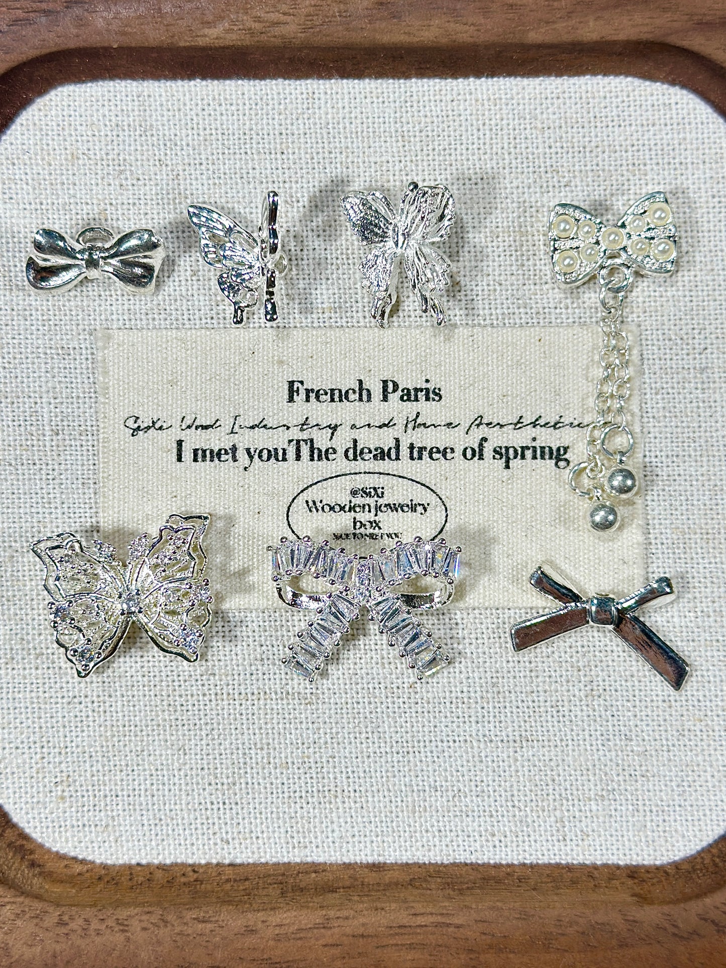 Bright silver butterfly spacer