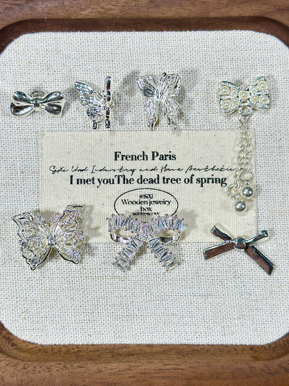 Bright silver butterfly spacer