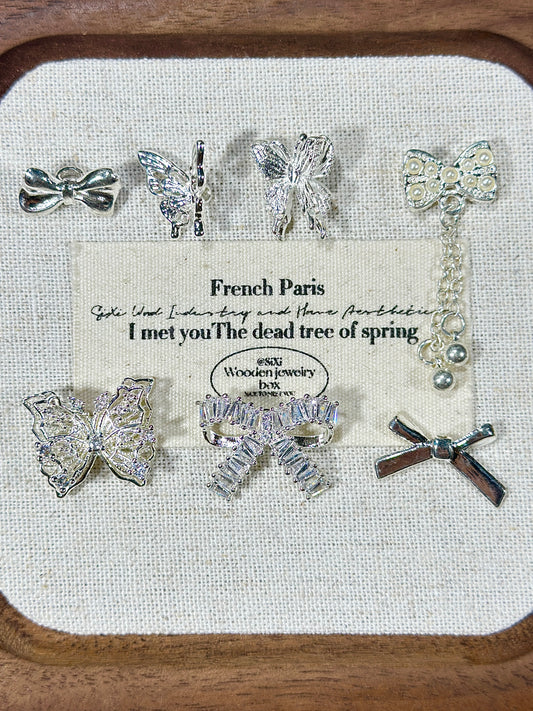 Bright silver butterfly spacer