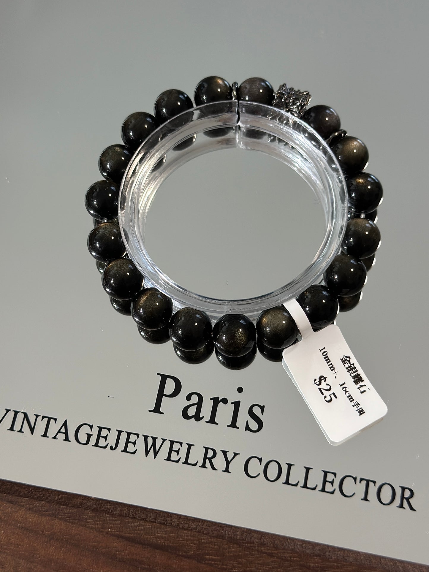 Gold, silver and obsidian design