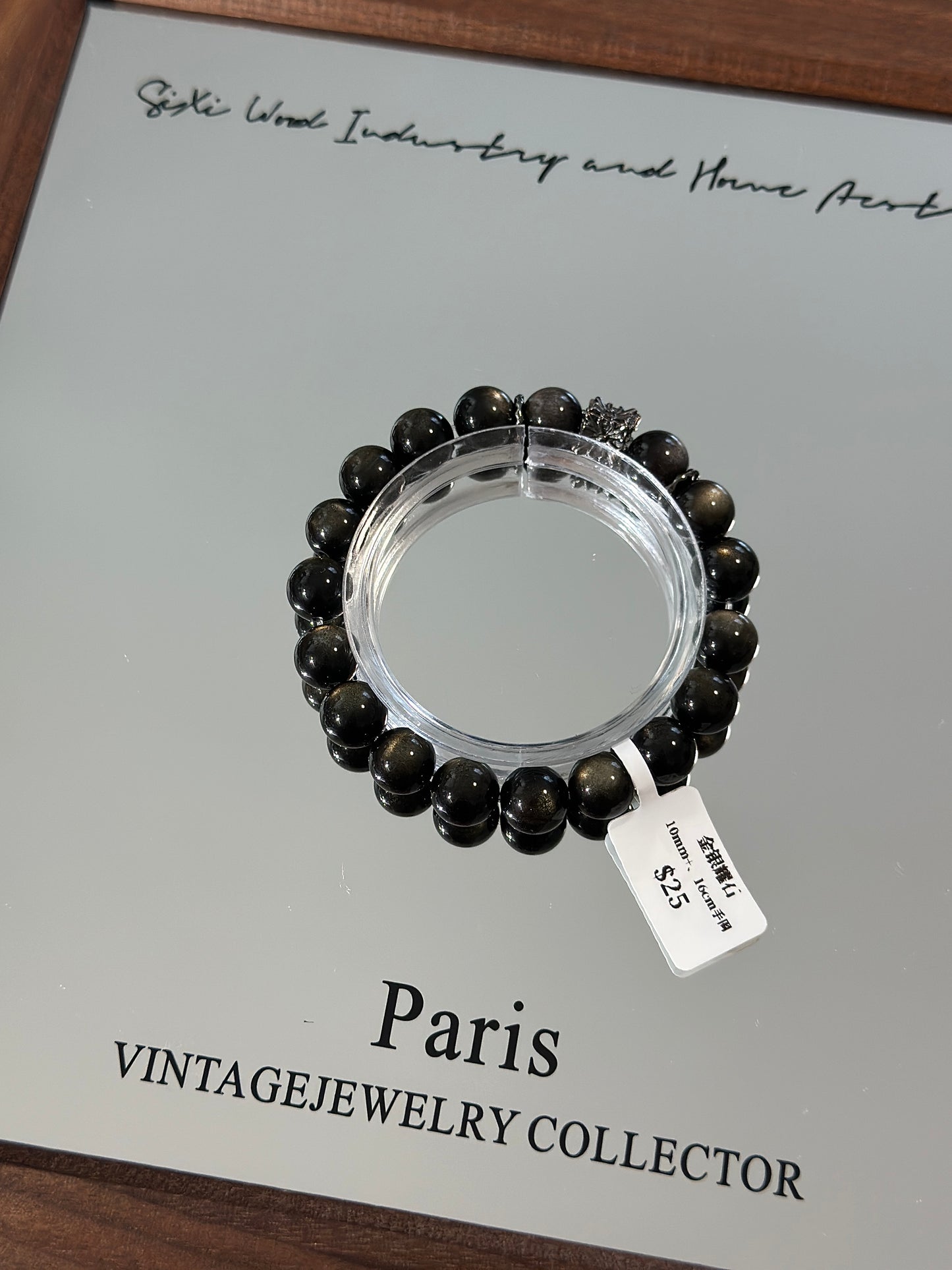 Gold, silver and obsidian design