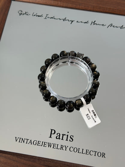 Gold, silver and obsidian design