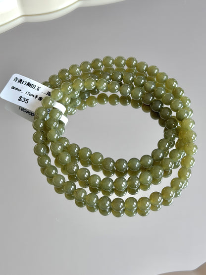 Celadon-yellow Hetian jade multi-strand bracelet